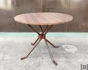 Mesa de caño marron con tapa de fórmica redonda